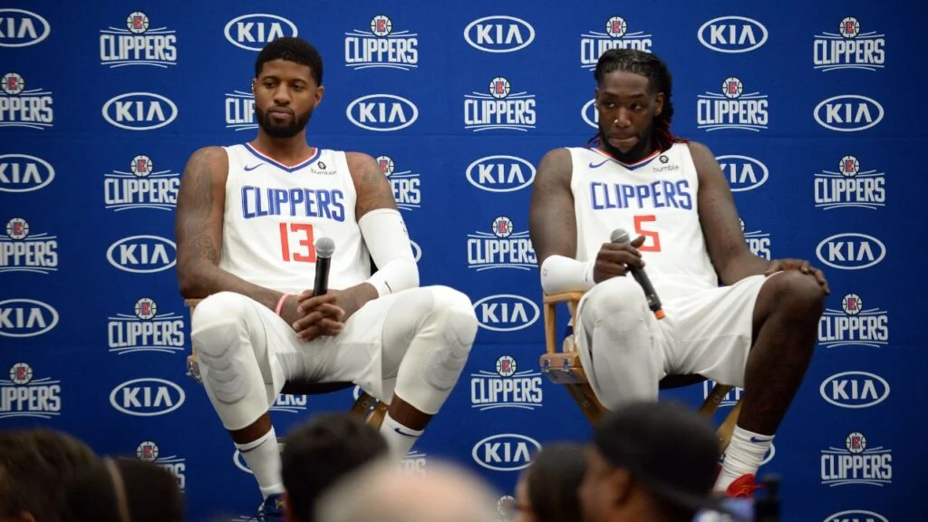 September 29, 2019; Los Angeles, CA, USA; Los Angeles Clippers forward Paul George (13) and forward Montrezl Harrell (5) speak with media during media day at LA Clippers Training Center. Mandatory Credit: Gary A. Vasquez-USA TODAY Sports